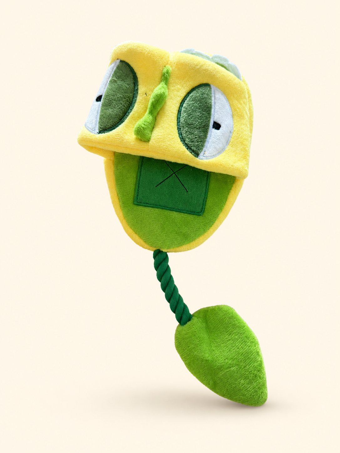 Front view of the interactive pea pod squeaky treat-hiding pet toy