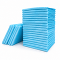 Blue disposable pet training pee pads stacked